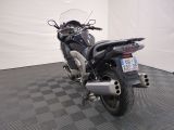 a motorcycle that is parked on a checkered floor