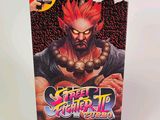 On voit ici la boîte du jeu Nintendo « Street Fighter II ».