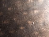 a close up view of a metal plate with writing on it