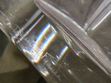 a close up of two clear plastic containers on a table