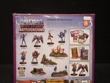 a box of action figures on a black surface