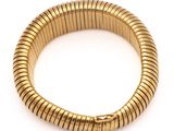 a gold bracelet with a snake clasp on a white background