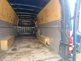 the back of a van with the door open showing the inside of it