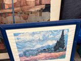 two framed paintings of boats in a blue frame on a carpet