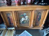 painting of a man on a horse on a wooden cabinet