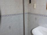 a bathroom with a sink and a shower in it