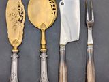 four different types of silverware on a table