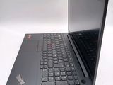 a laptop with a black keyboard sitting on a white surface