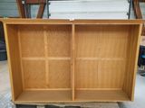 a wooden cabinet that is sitting on a pallet