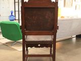 a chair that is sitting in the middle of a room