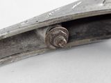 a close up of a metal object on a white surface