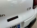 a close up of a car ' s rear end with a sticker on it