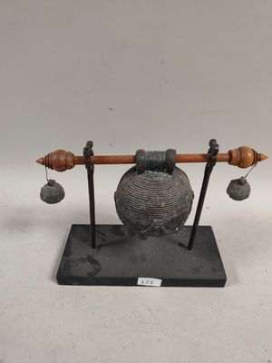 an image of a sculpture of a bell and bells on a stand