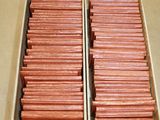 two boxes of hotdogs sitting on a table