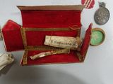 a small red box with a note inside of it