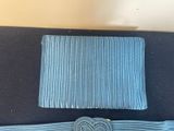 two pieces of blue fabric with a heart on top of it
