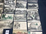 several black and white photographs of old buildings and buildings on a table