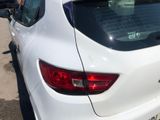 a white car that is parked in a parking lot