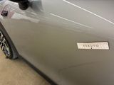 a close up of a car door with a sticker on it