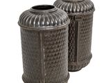 two vases that are sitting on a white surface