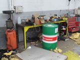 a green barrel sitting in the middle of a room