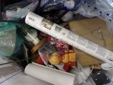 a pile of trash that has a roll of paper and other items in it