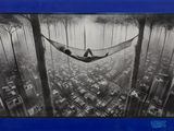 photographie en noir et blanc d'une personne allongée dans un hamac au cœur d'une ville