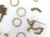 many different types of jewelry on a white surface
