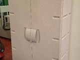 a white refrigerator sitting on a pallet in a store