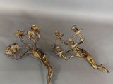pair of gold plated candlesticks with flowers and leaves