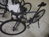 many bikes that are lined up on the floor