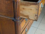 a wooden desk with a drawer on top of it