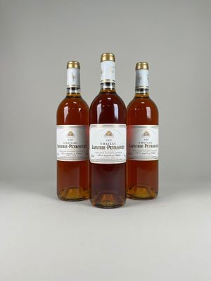 three bottles of wine sitting next to each other on a table