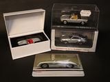 a box with a silver car in it and a box with a silver car in it