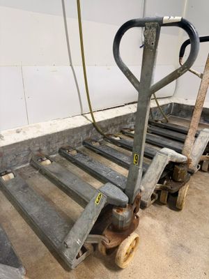 a dolly cart with a hand truck attached to it