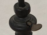 a close up of a metal pole with a heart on it