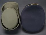 two hats are sitting next to each other on a table