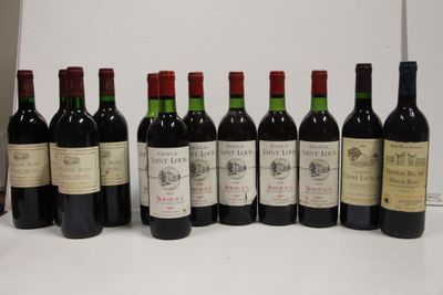 several bottles of wine are lined up on a table
