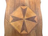an image of a wooden plaque with a cross design on it