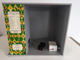 a box that has a small electronic device inside of it