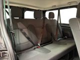 the back seats of a car with a seat belt attached to the back of it