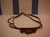 a brown leather belt with a metal buckle on it
