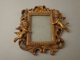 a picture of a gold frame with angels on it
