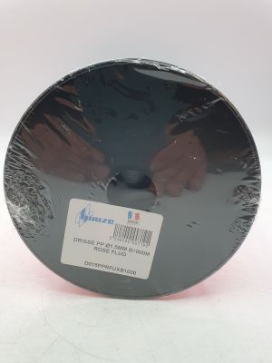 un objet rond et noir sur lequel est apposée une étiquette blanche