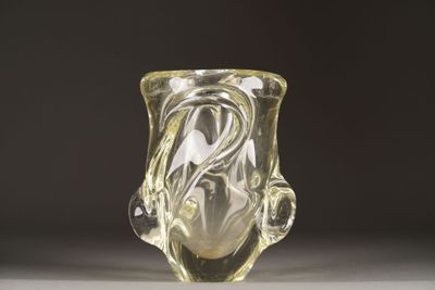 a clear glass vase with a swirly design on it