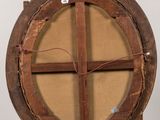 an old wooden easel with a painting on top of it
