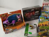many toys that are sitting on a bed