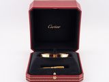 cartier 18k yellow gold and diamond bracelet and pen set