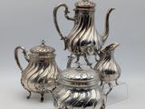 three piece silver plated tea and coffee set on stand