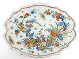 a plate that has a bird design on it